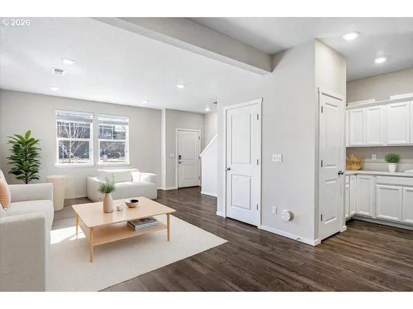 a living room with furniture and windows