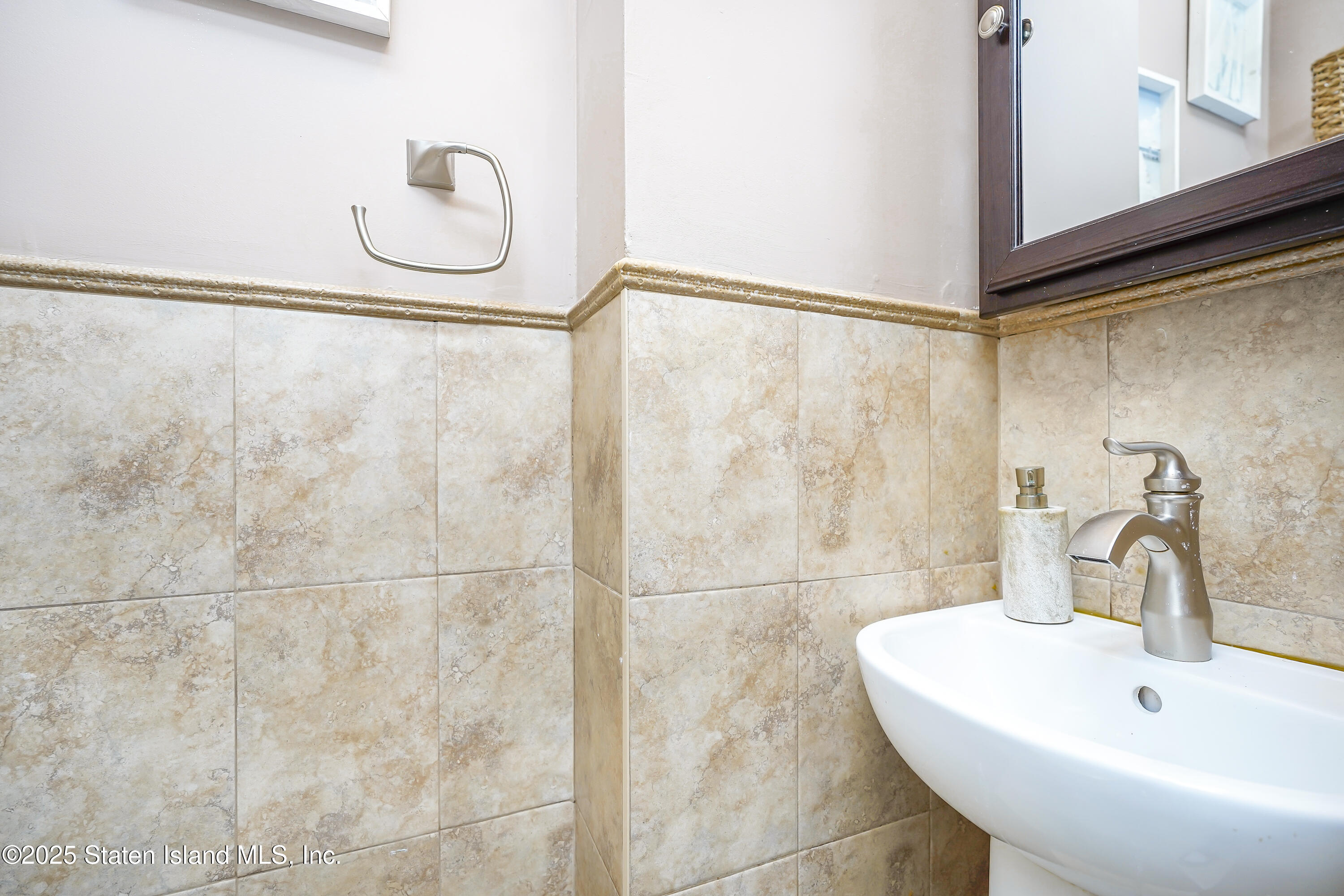 994 Rensselaer Avenue Staten Island, NY 10309 - Photo 12 of 34 a bathroom with a sink and a shower