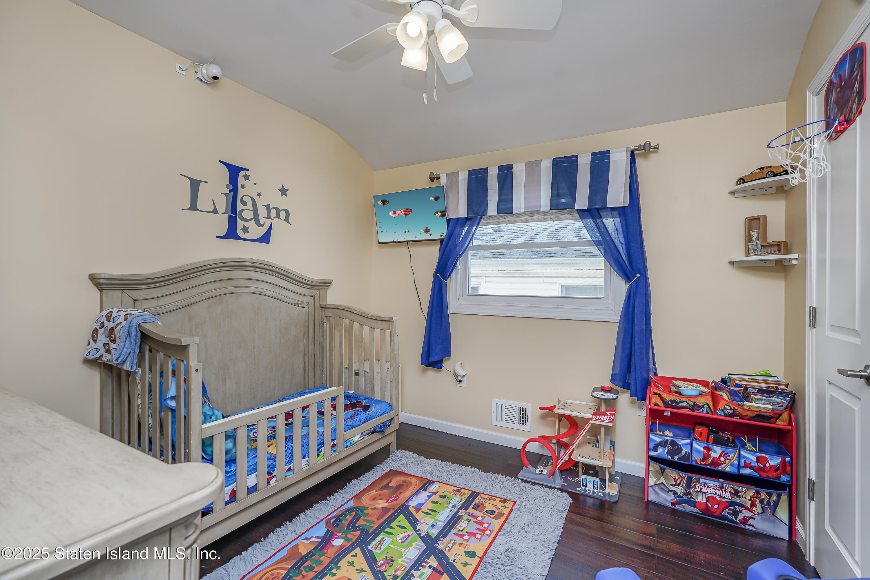 994 Rensselaer Avenue Staten Island, NY 10309 - Photo 18 of 34 a bedroom with furniture and a baby crib