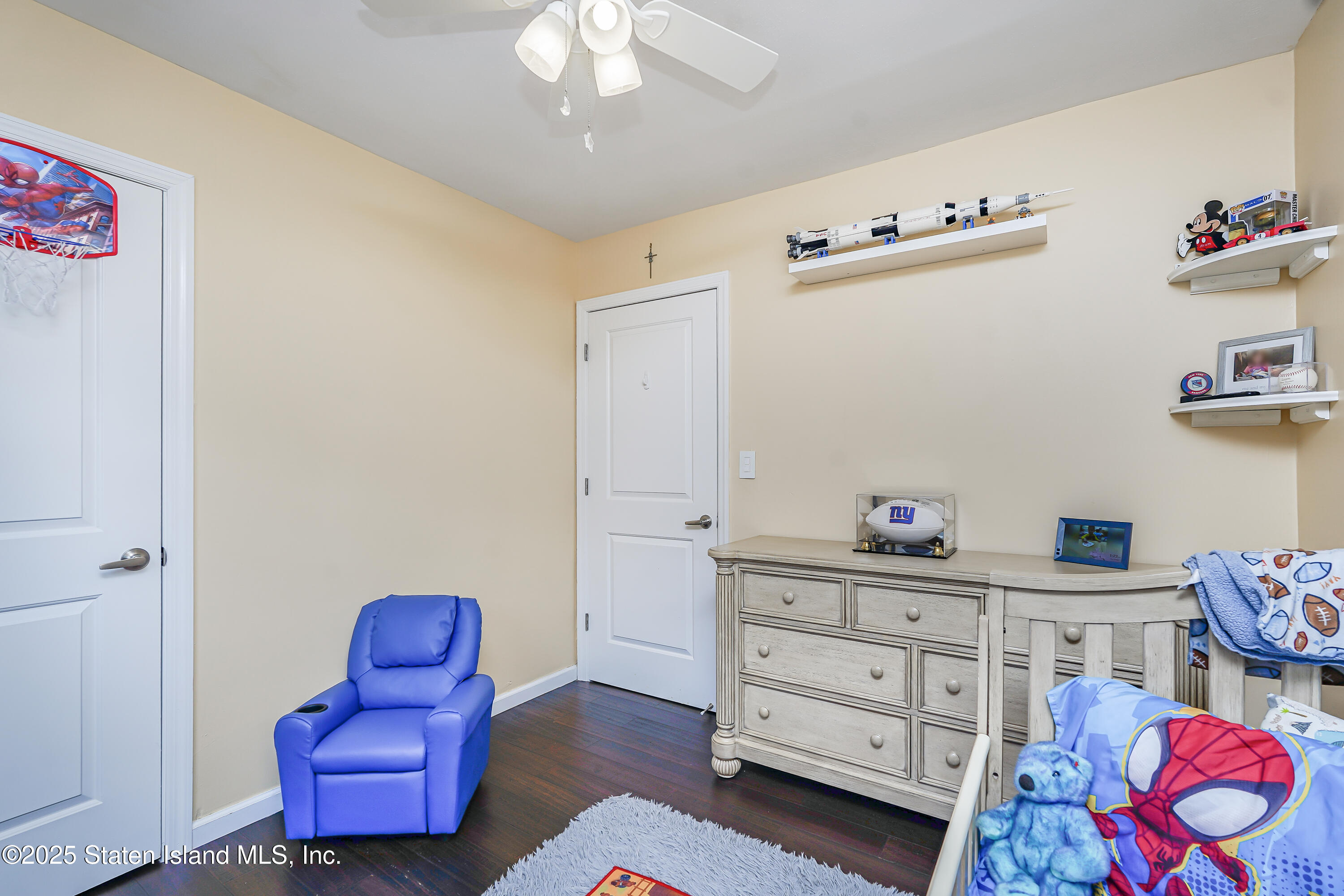 994 Rensselaer Avenue Staten Island, NY 10309 - Photo 19 of 34 a room with furniture and wooden floor