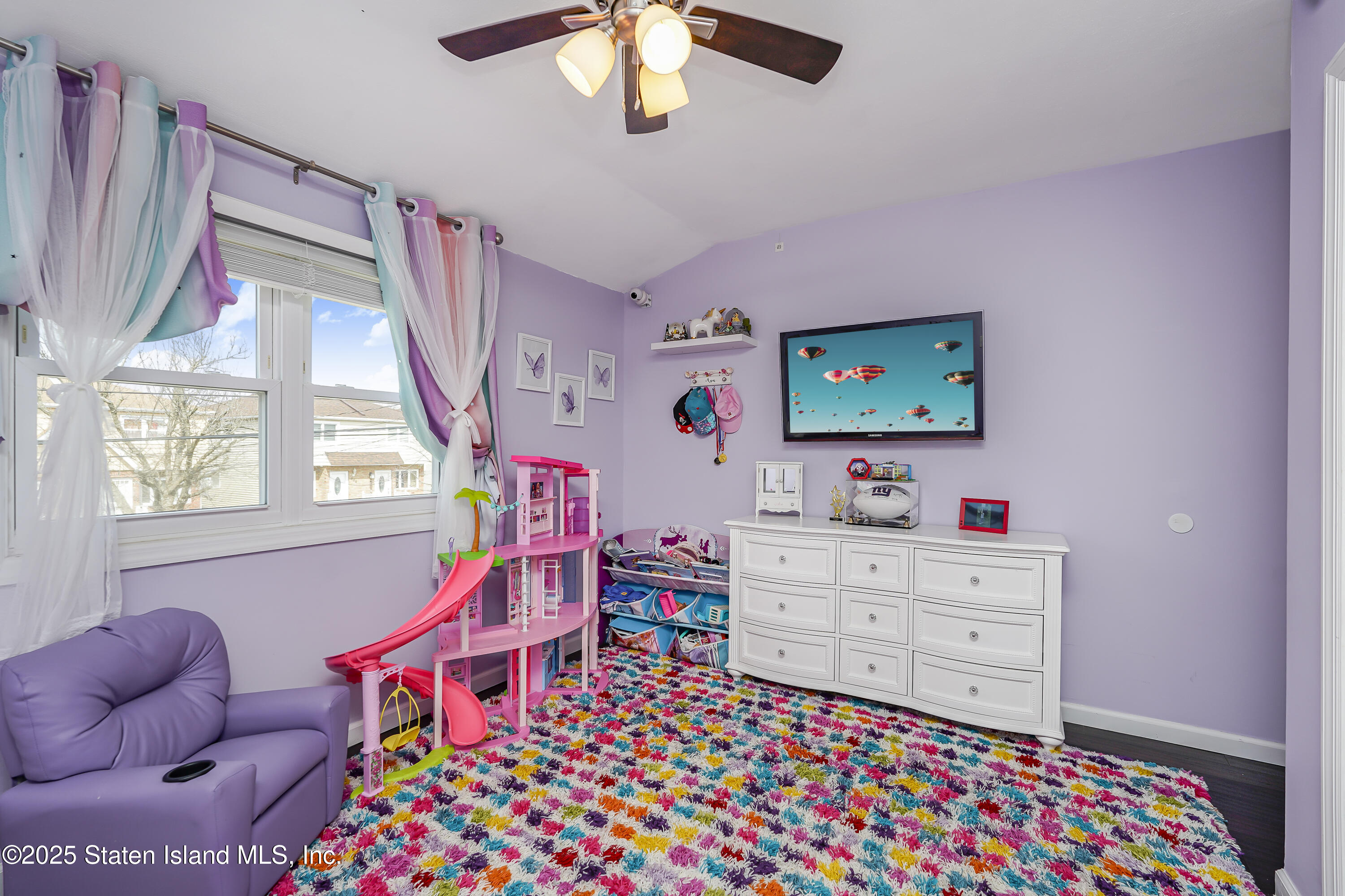 994 Rensselaer Avenue Staten Island, NY 10309 - Photo 20 of 34 a living room with furniture and a flat screen tv