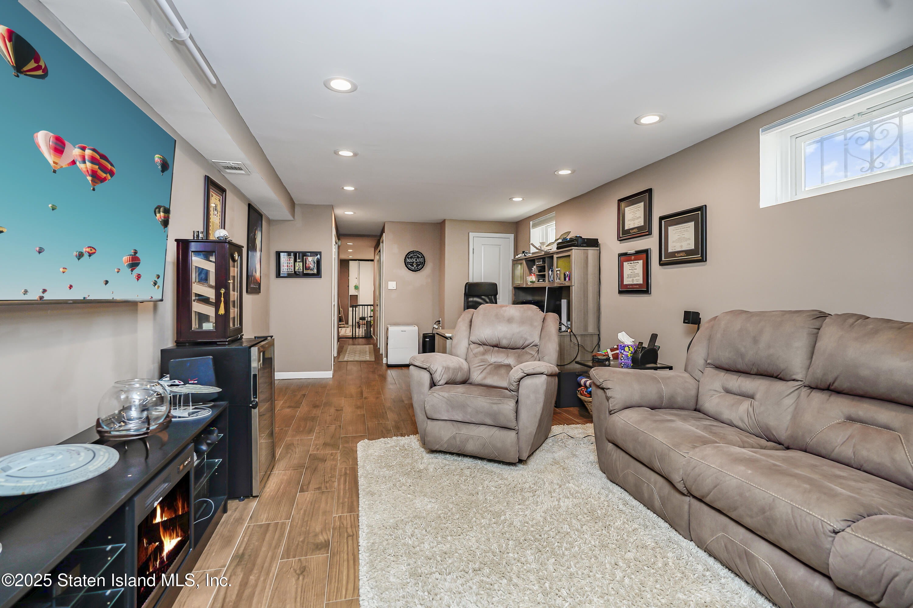 994 Rensselaer Avenue Staten Island, NY 10309 - Photo 25 of 34 a living room with furniture and a flat screen tv