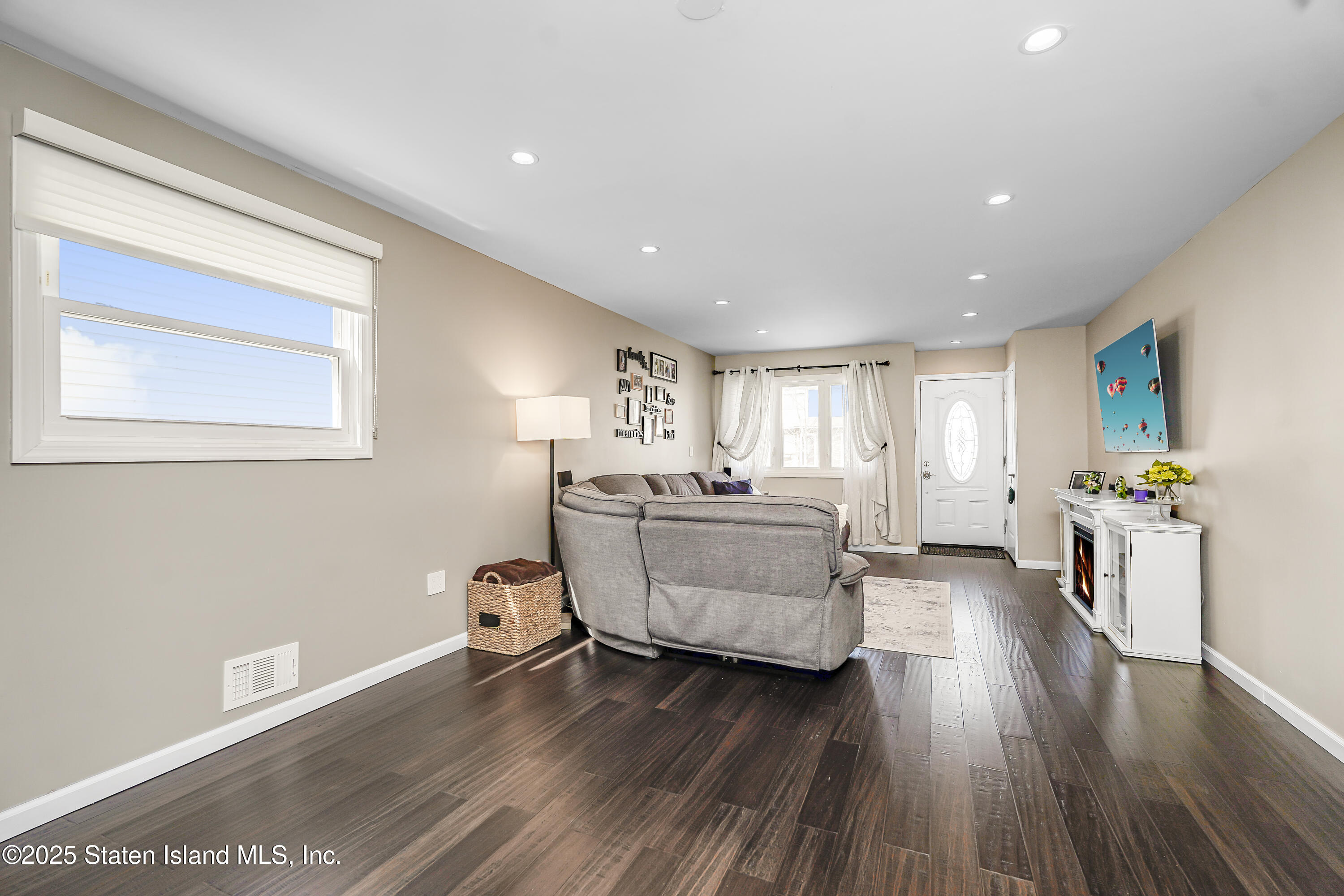 994 Rensselaer Avenue Staten Island, NY 10309 - Photo 5 of 34 a living room with furniture and a wooden floor