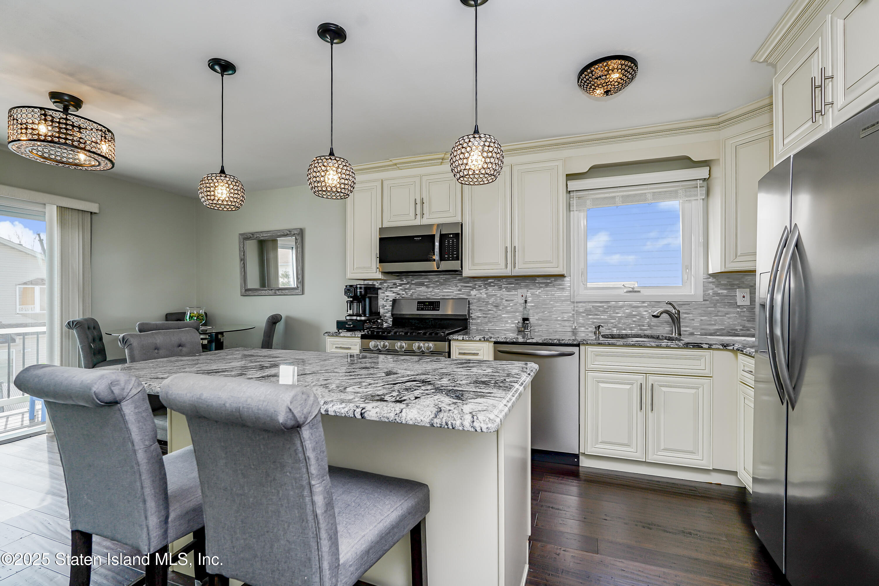 994 Rensselaer Avenue Staten Island, NY 10309 - Photo 8 of 34 a kitchen with a center island and appliances