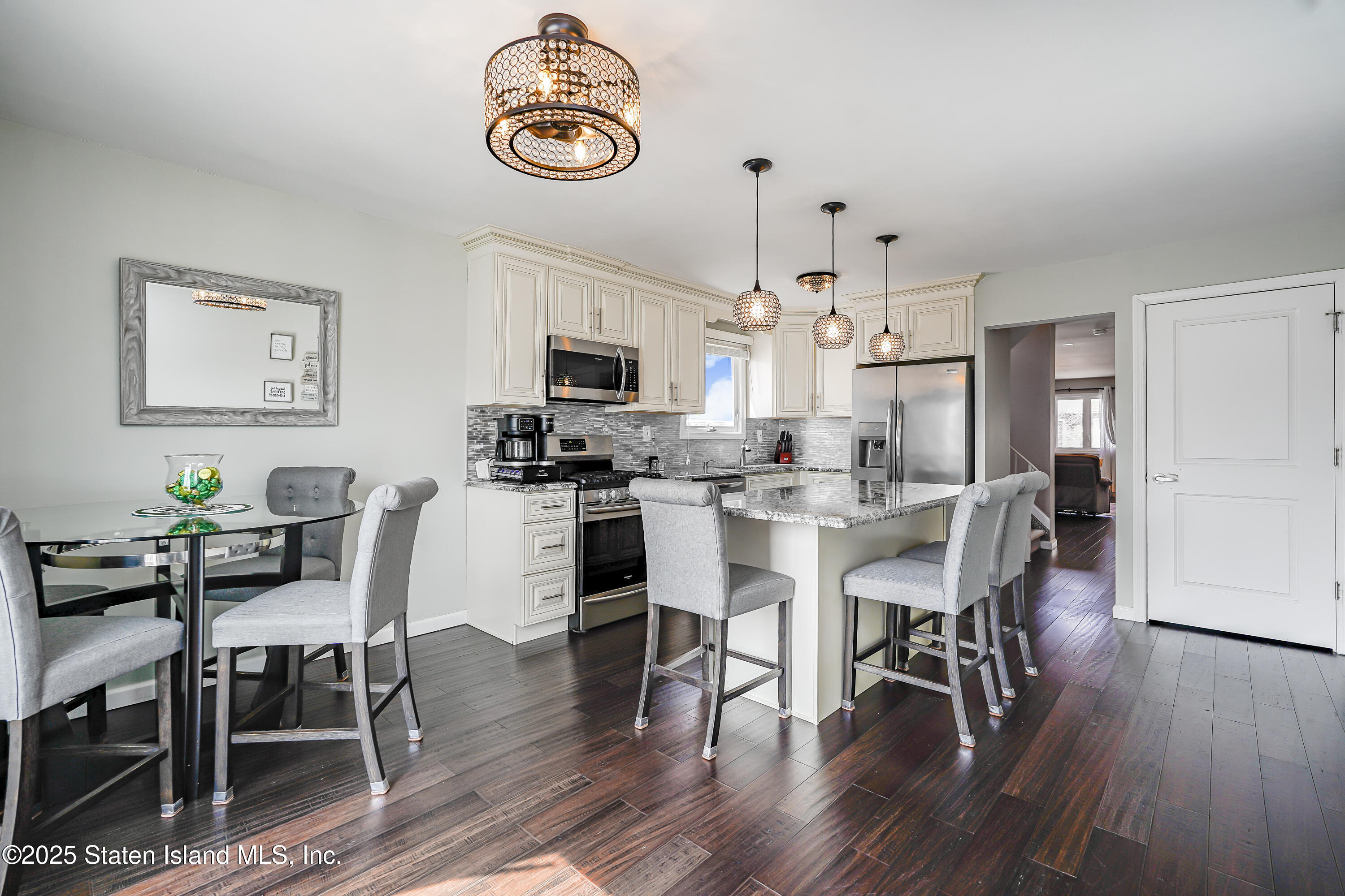 994 Rensselaer Avenue Staten Island, NY 10309 - Photo 10 of 34 a view of kitchen with dining table and chairs