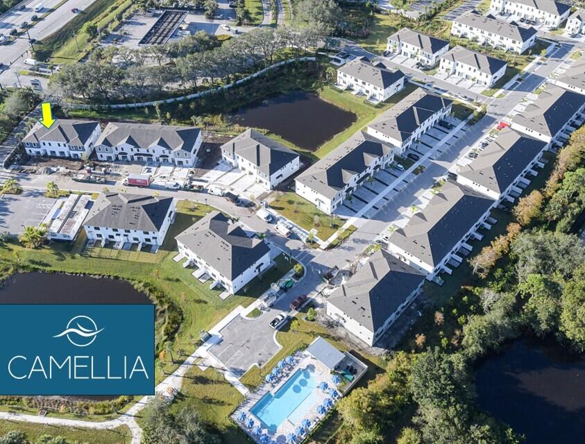 7798 Southwest Bentley Lane, Unit LATITUDE 8316 Stuart, FL 34997 - Photo 2 of 21 an aerial view of residential house with outdoor space and parking