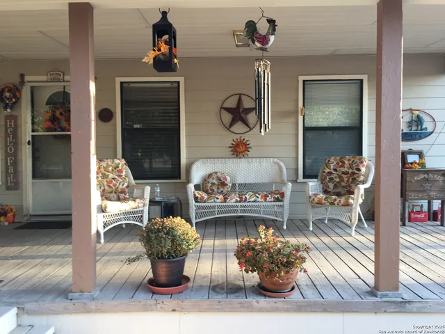 a front view of a dining room with wooden floor