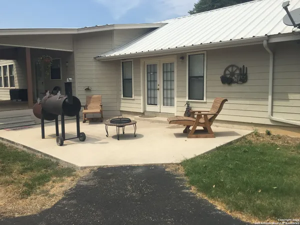 a view of house with outdoor seating space