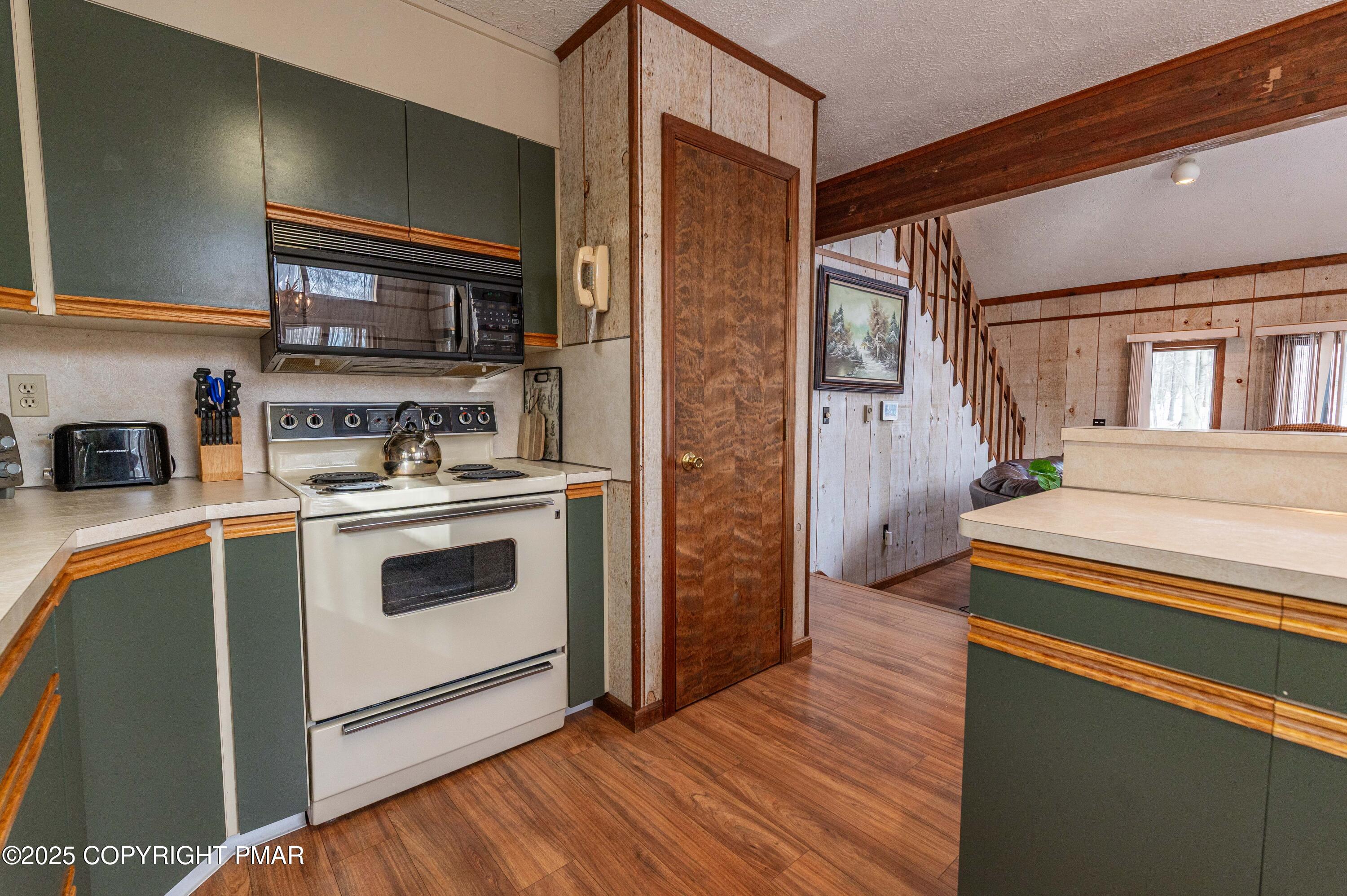 178 Cardinal Drive, Unit R2108 Gouldsboro, PA 18424 - Photo 12 of 58 a kitchen with stainless steel appliances a stove and a refrigerator