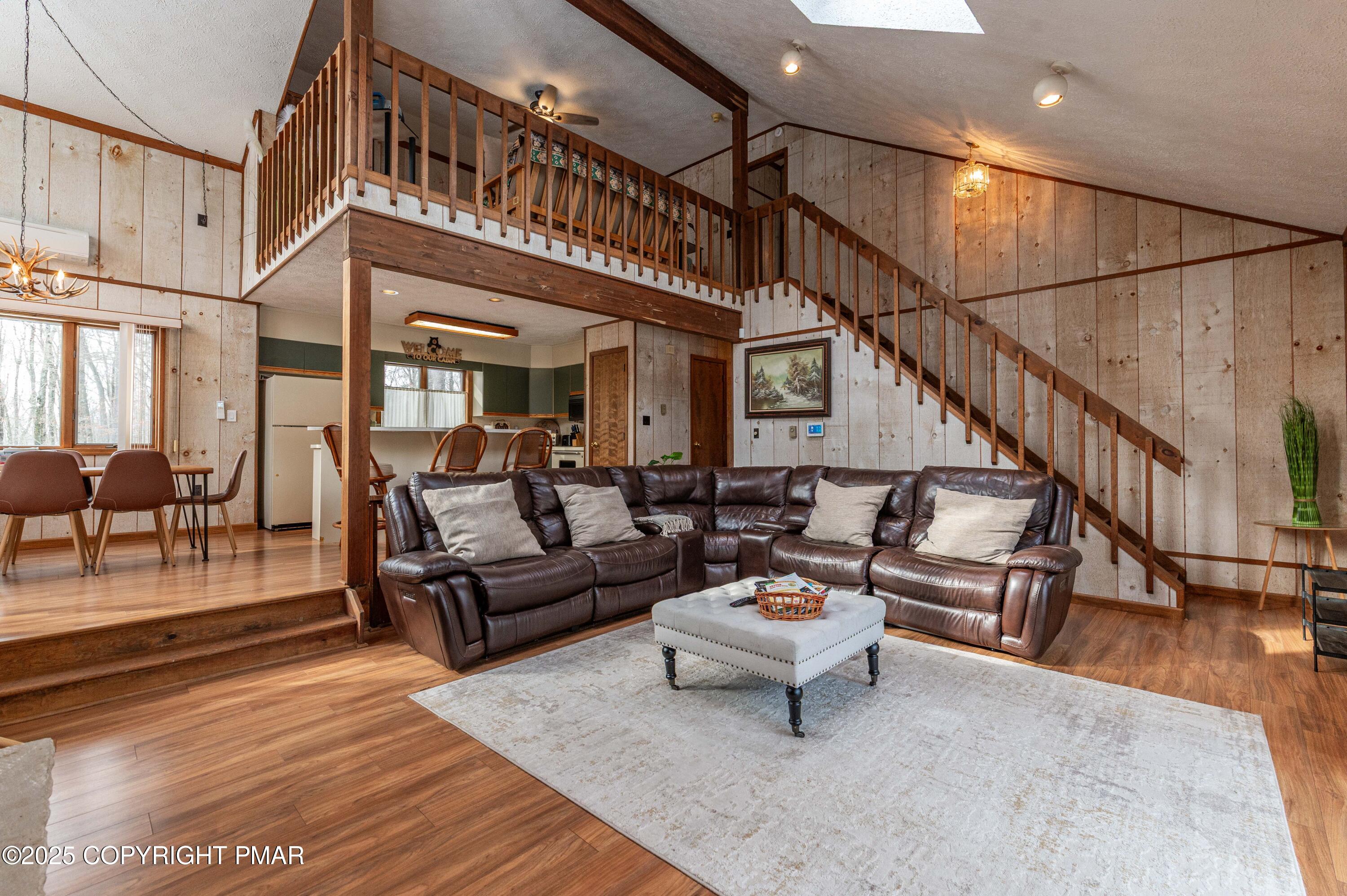 178 Cardinal Drive, Unit R2108 Gouldsboro, PA 18424 - Photo 14 of 58 a living room with furniture or stairs and a wooden floor