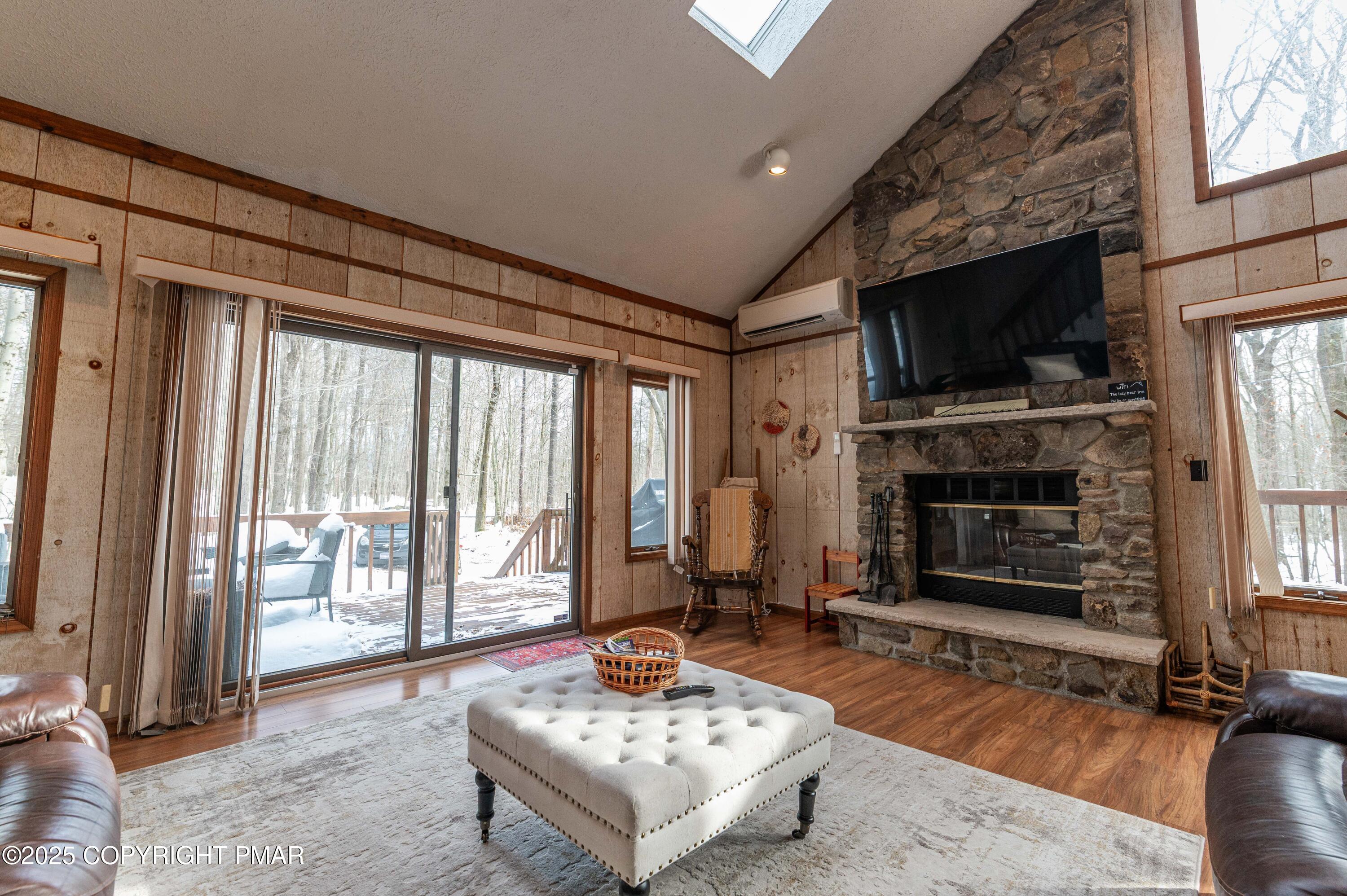 178 Cardinal Drive, Unit R2108 Gouldsboro, PA 18424 - Photo 18 of 58 a living room with fireplace furniture and a flat screen tv