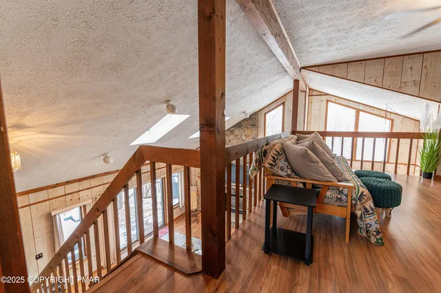 a view of front door with dining room and wooden floor