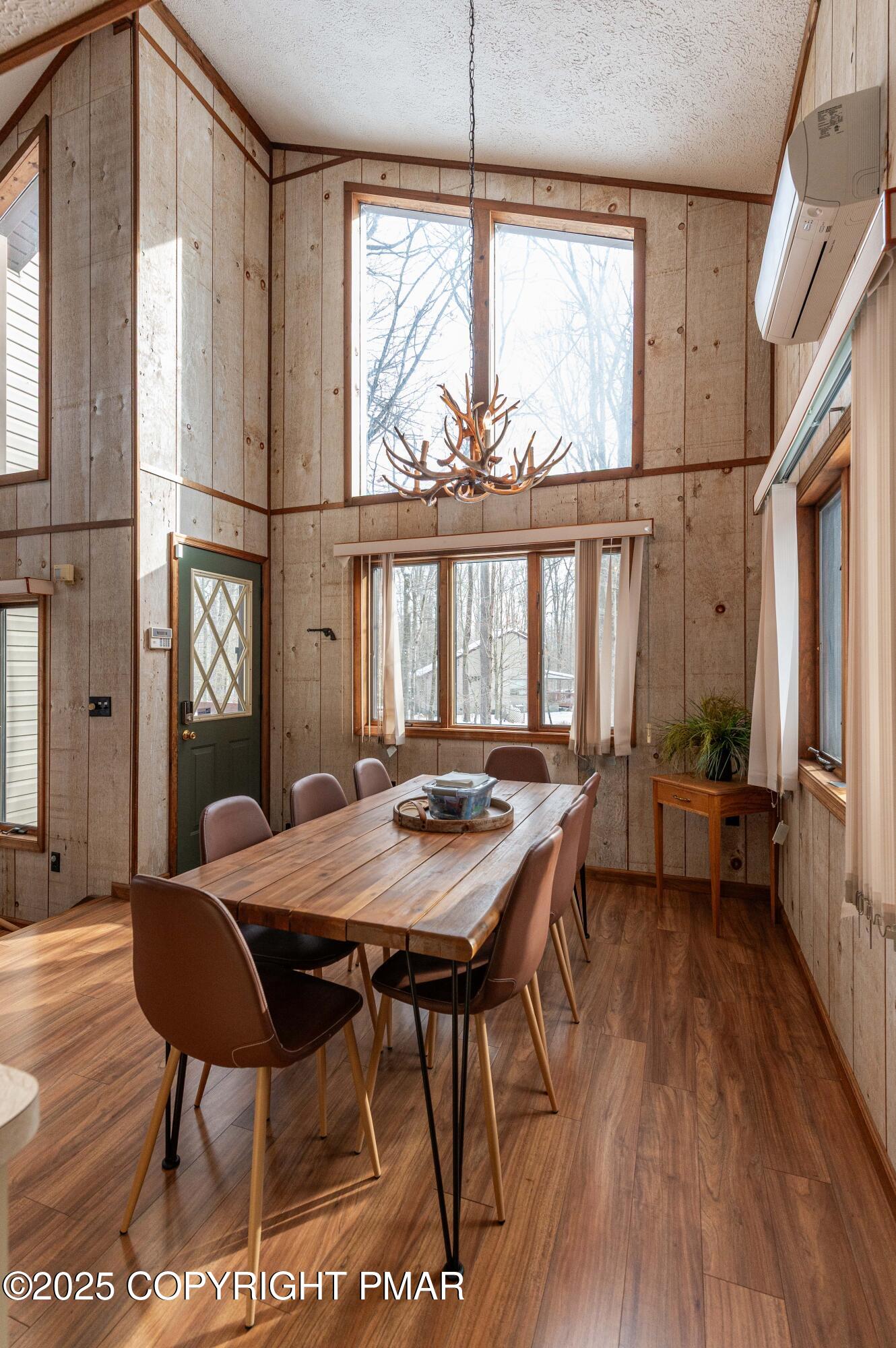 178 Cardinal Drive, Unit R2108 Gouldsboro, PA 18424 - Photo 3 of 58 a view of a dining room with furniture window and wooden floor