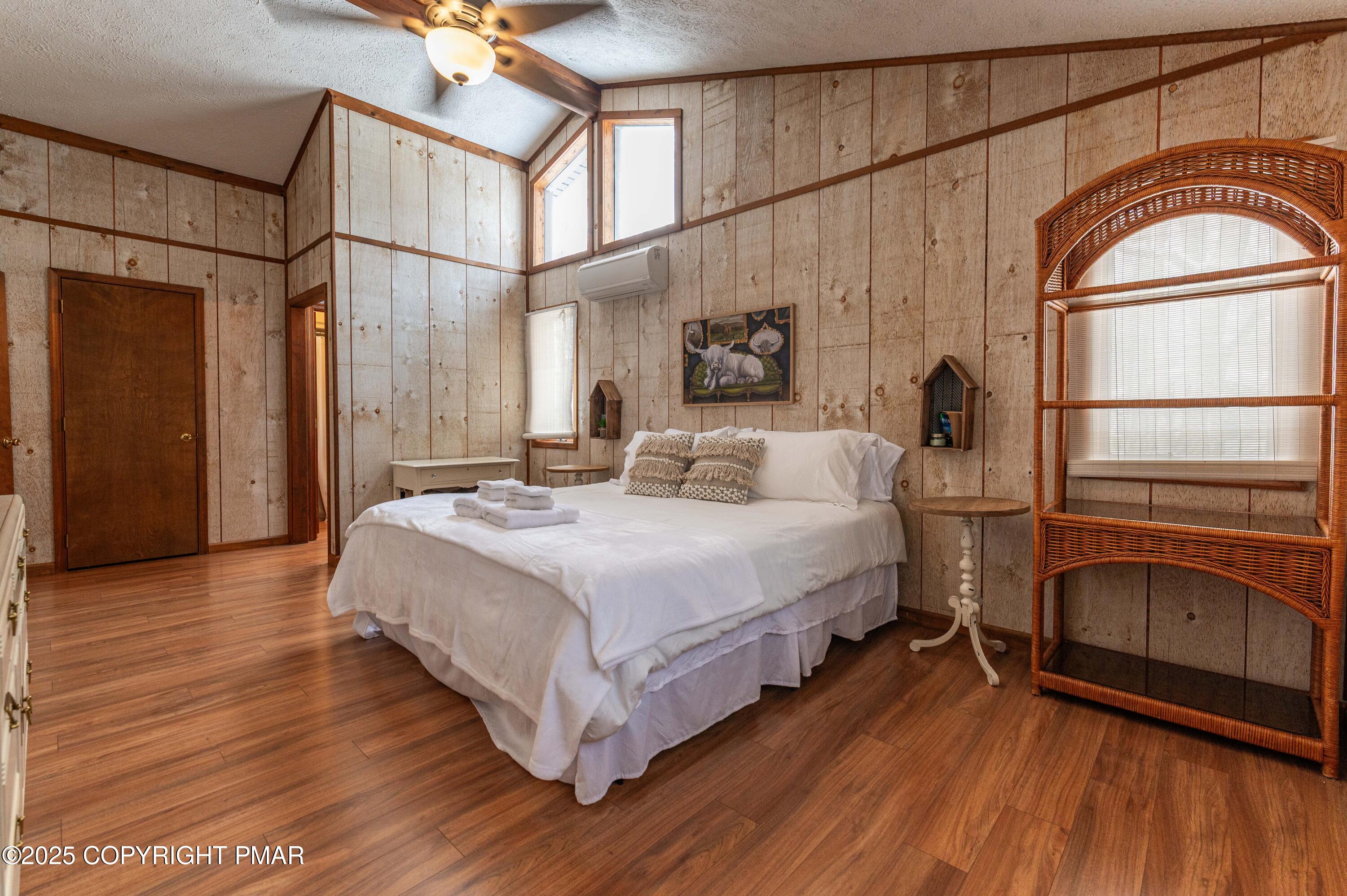 178 Cardinal Drive, Unit R2108 Gouldsboro, PA 18424 - Photo 32 of 58 a bedroom with a bed mirror and a window