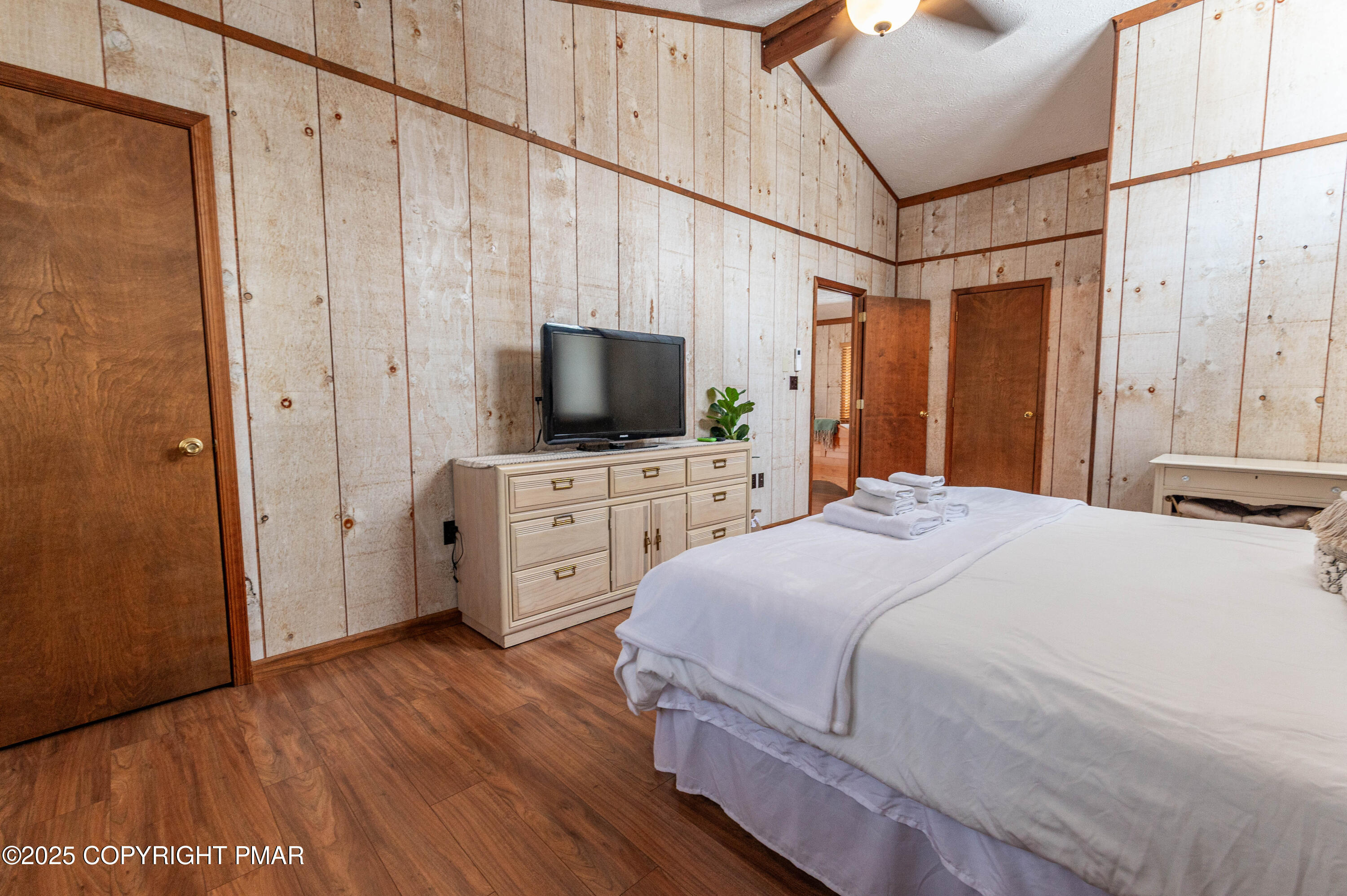 178 Cardinal Drive, Unit R2108 Gouldsboro, PA 18424 - Photo 33 of 58 a bedroom with a bed and a flat screen tv