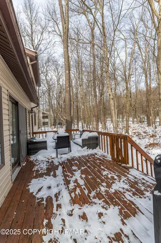 a view of a house with snow on the road