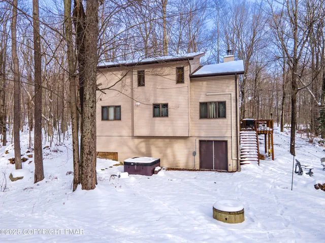a view of a yard with large trees