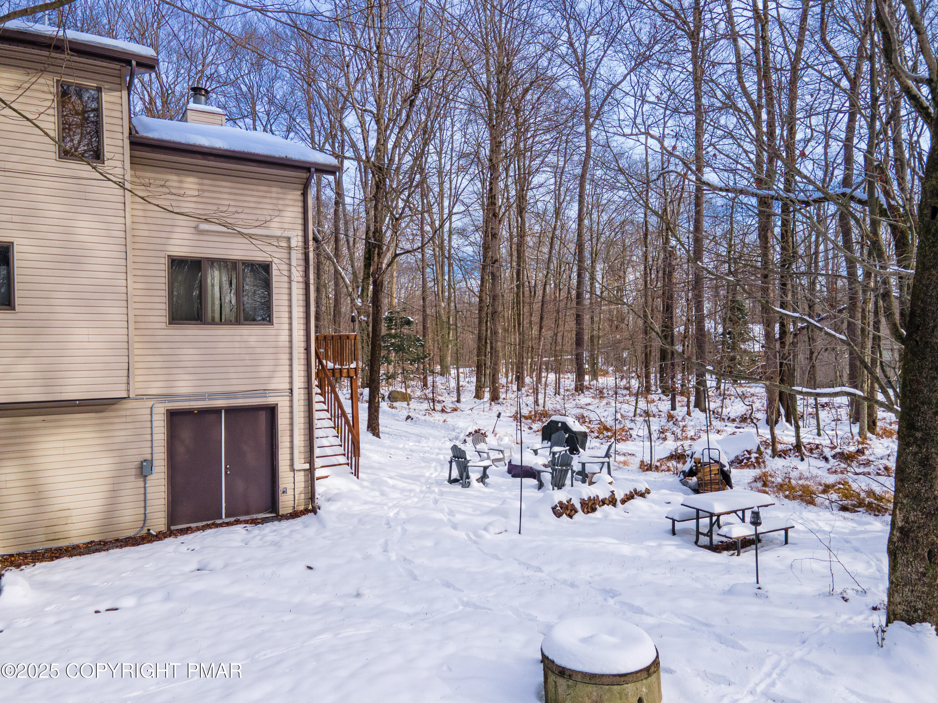 178 Cardinal Drive, Unit R2108 Gouldsboro, PA 18424 - Photo 51 of 58 a view of a patio with dining table and chairs with a fire pit