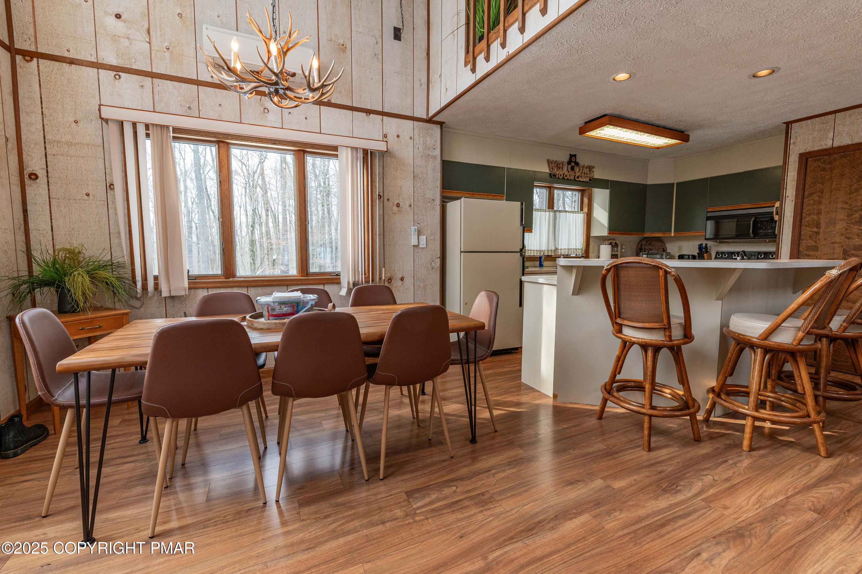 178 Cardinal Drive, Unit R2108 Gouldsboro, PA 18424 - Photo 6 of 58 a view of a dining room with furniture and wooden floor