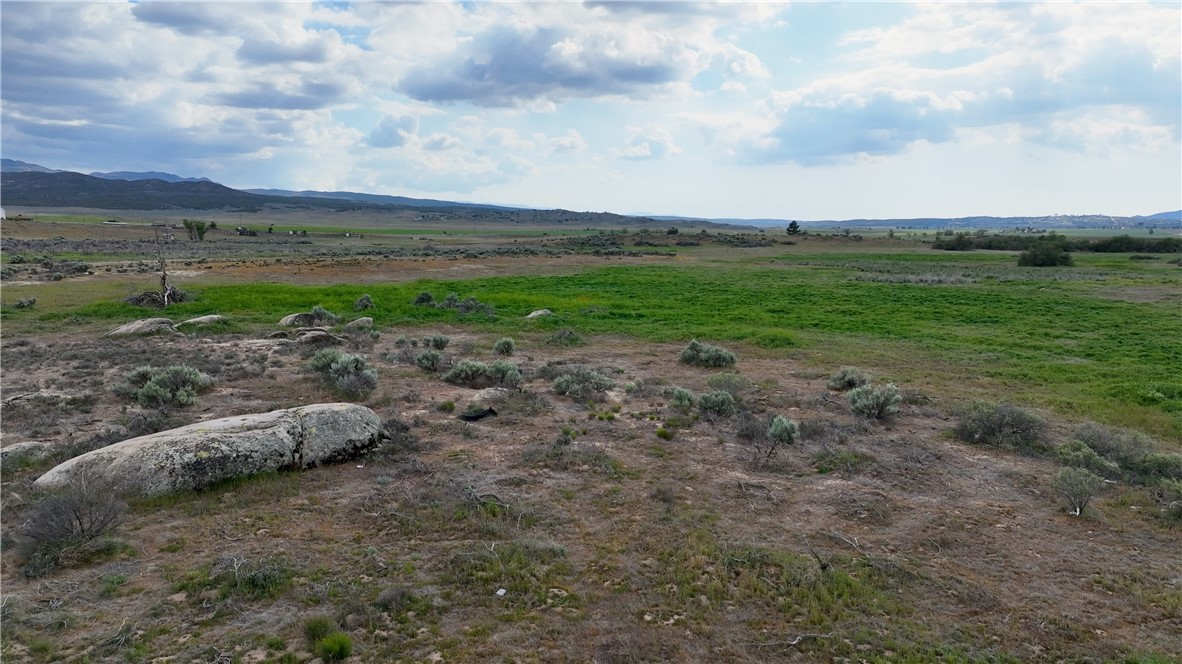 4 Kirby Road Anza, CA 92539 - Photo 2 of 8 a view of a yard with wooden fence