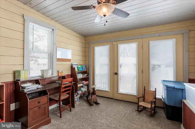 a kitchen with stainless steel appliances granite countertop a sink refrigerator and microwave