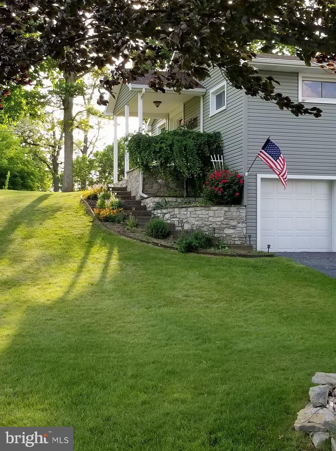 1177 Walker Road Chambersburg, PA 17202 - Photo 2 of 15 Charming home with lush green landscape.
