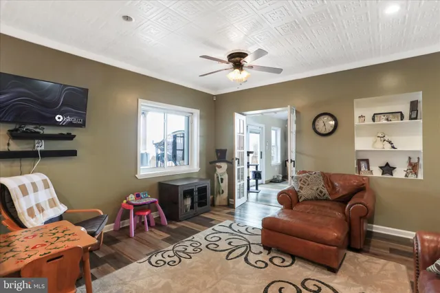 a view of a house with a yard and sitting area