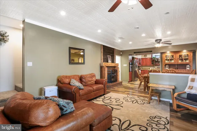 a view of a house with a yard covered in snow