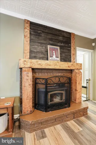 a view of a house with snow on the road