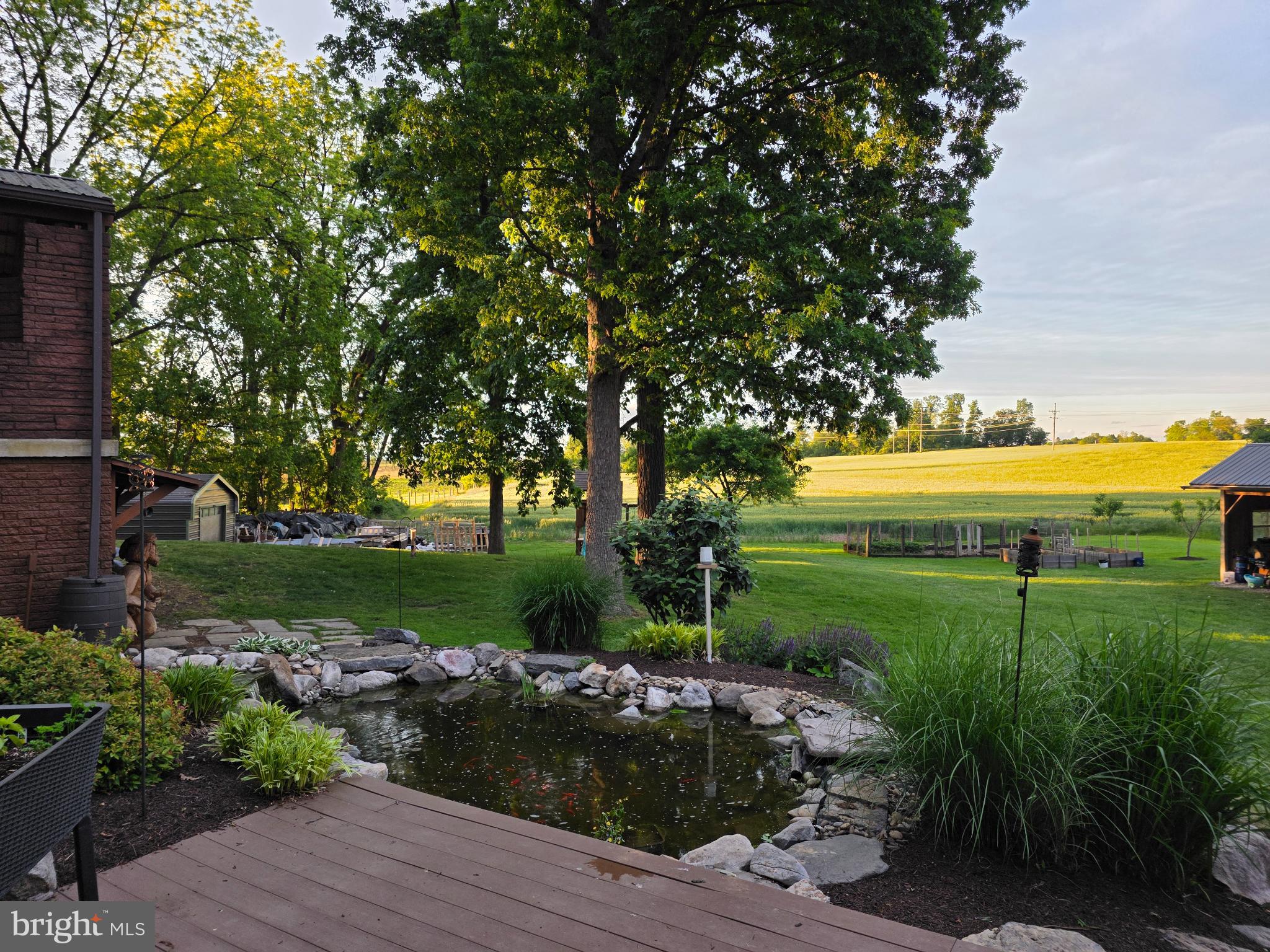 1177 Walker Road Chambersburg, PA 17202 - Photo 7 of 15 Tranquil garden retreat with serene pond.