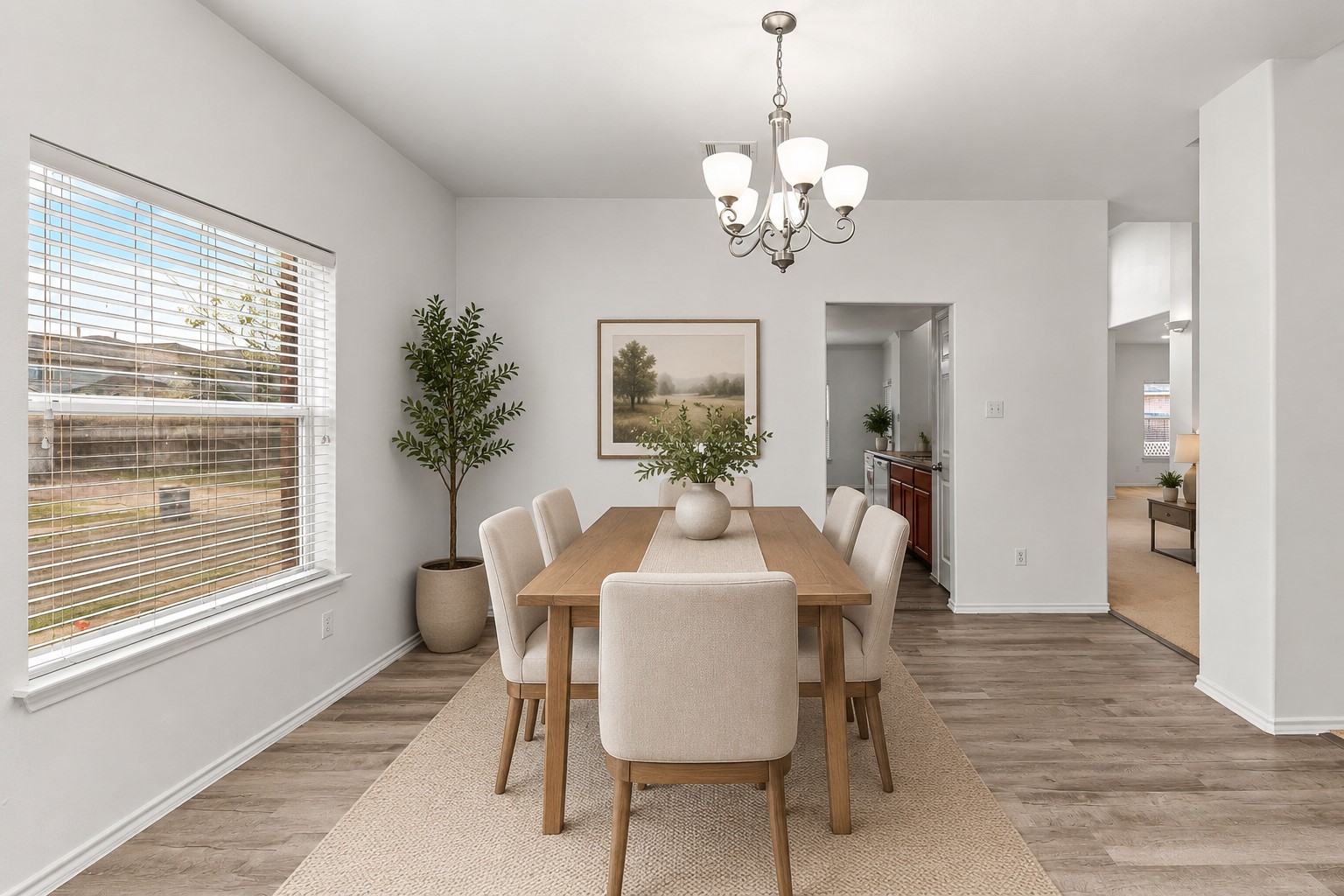 6700 Tulloch Way Austin, TX 78754 - Photo 7 of 39 a view of a dining room with furniture window and wooden floor