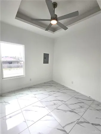 a view of an empty room and window
