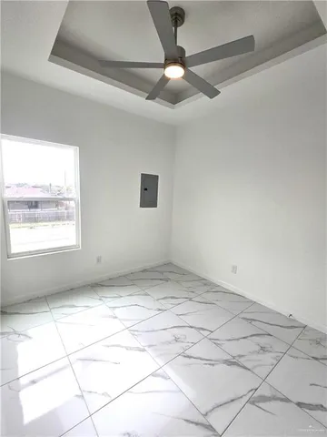 a view of an empty room and window