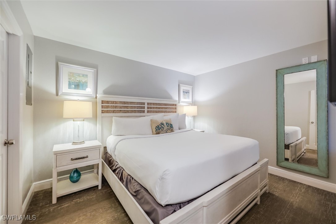 2117 Gulf Beach Villas Captiva, FL 33924 - Photo 13 of 24 a bedroom with a bed and a window