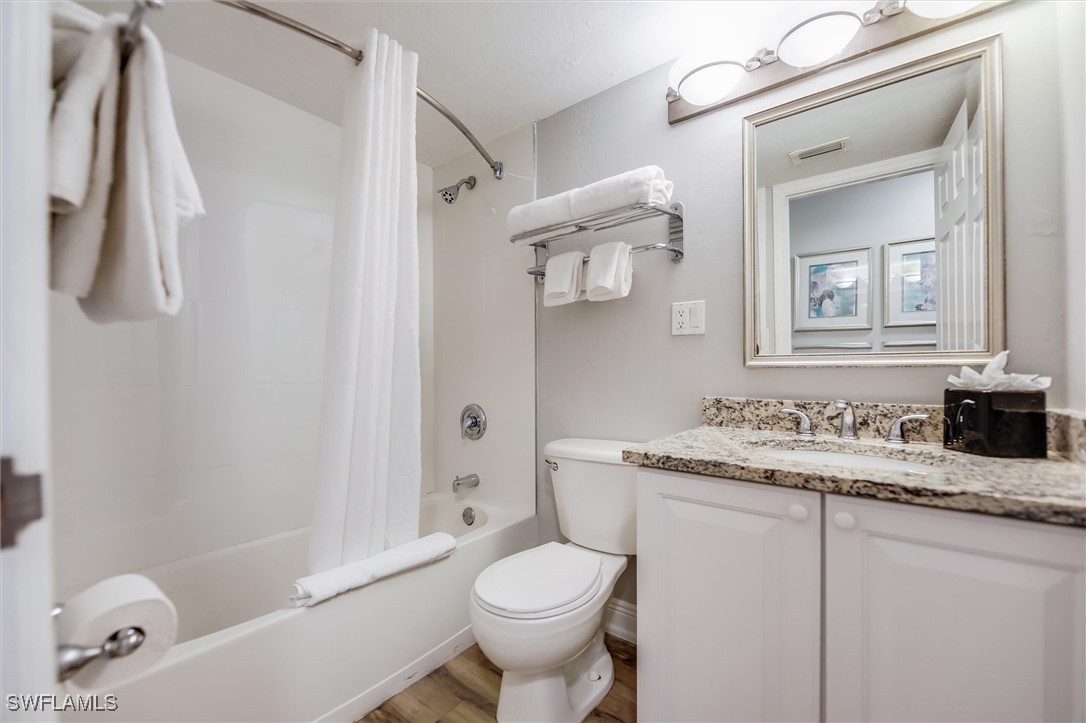 2117 Gulf Beach Villas Captiva, FL 33924 - Photo 17 of 24 a bathroom with a granite countertop sink toilet and shower