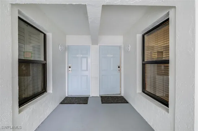 a view of bedroom with window and hardwood floor