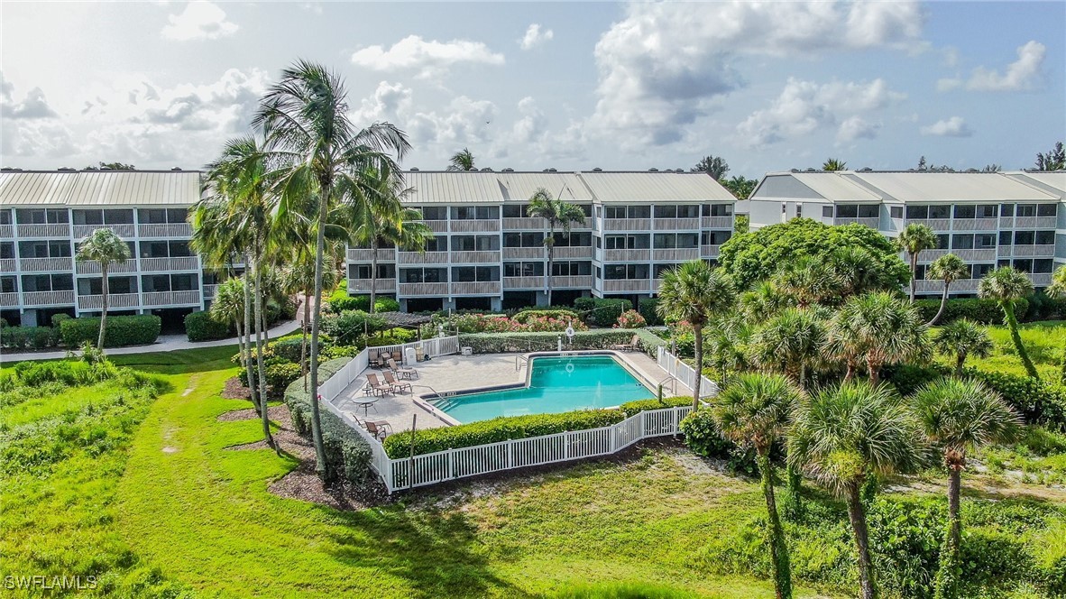 2117 Gulf Beach Villas Captiva, FL 33924 - Photo 21 of 24 a view of a swimming pool with a patio