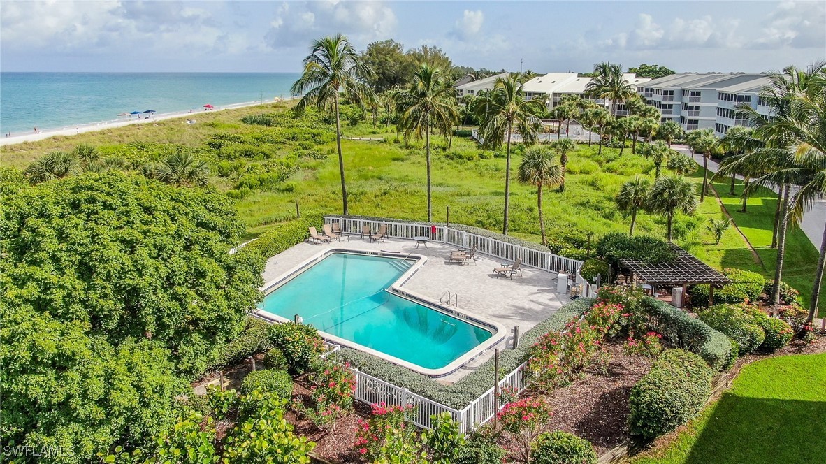 2117 Gulf Beach Villas Captiva, FL 33924 - Photo 22 of 24 view of a pool with a garden