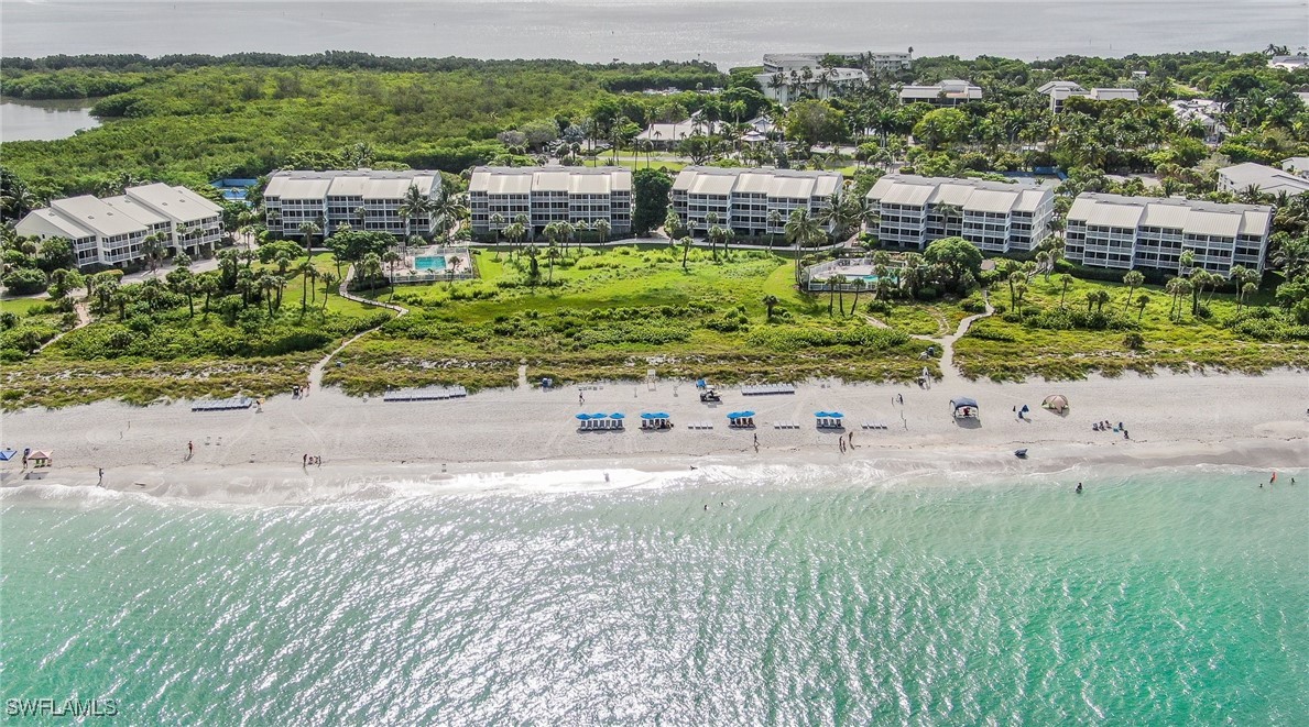 2117 Gulf Beach Villas Captiva, FL 33924 - Photo 23 of 24 an aerial view of residential houses with outdoor space and trees