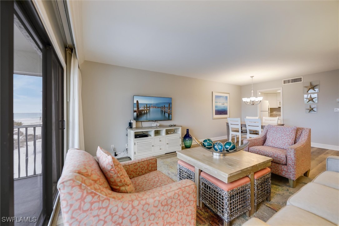 2117 Gulf Beach Villas Captiva, FL 33924 - Photo 7 of 24 a living room with furniture and a table