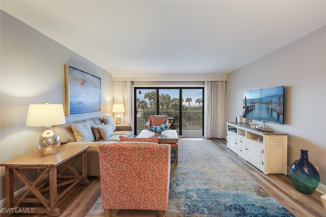 2117 Gulf Beach Villas Captiva, FL 33924 - Photo 8 of 24 a living room with furniture and a large window