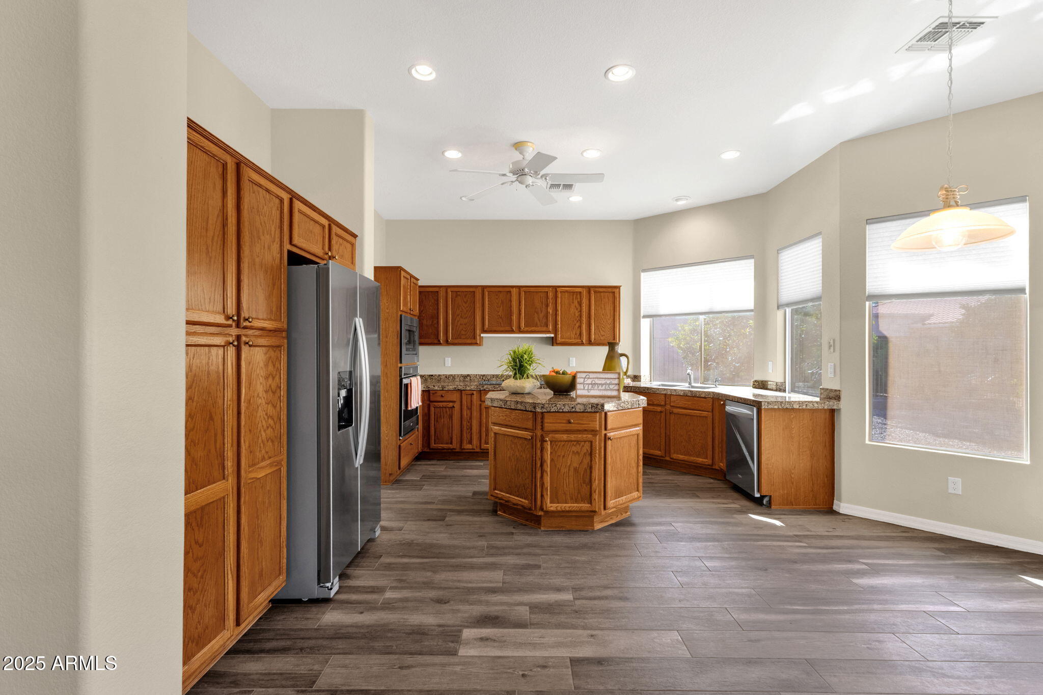 4735 East Azalea Drive Gilbert, AZ 85298 - Photo 13 of 37 a kitchen with refrigerator cabinets and wooden floor