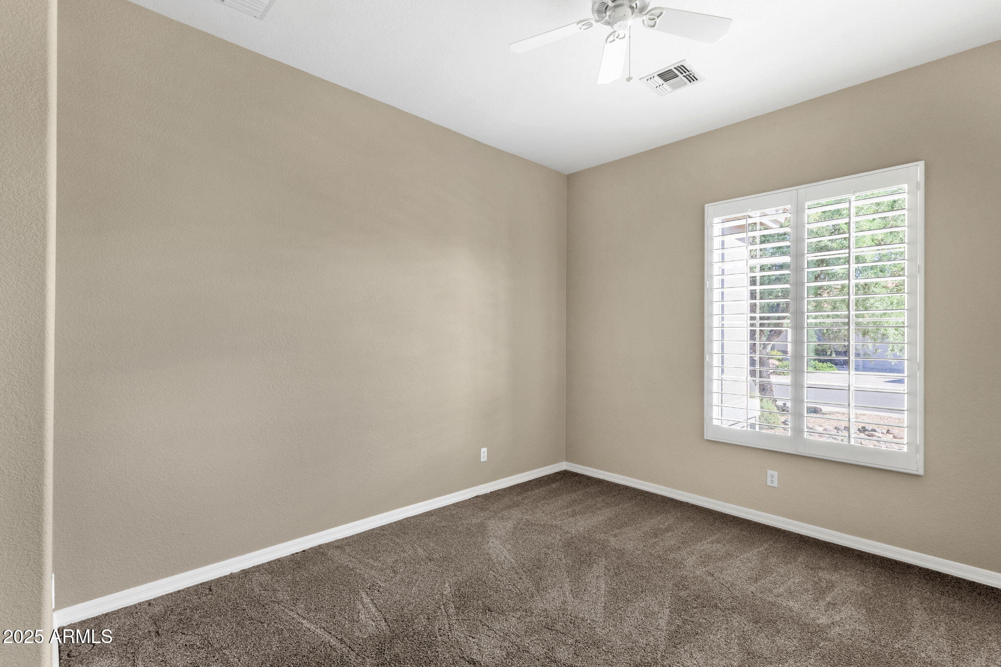 4735 East Azalea Drive Gilbert, AZ 85298 - Photo 17 of 37 an empty room with a window