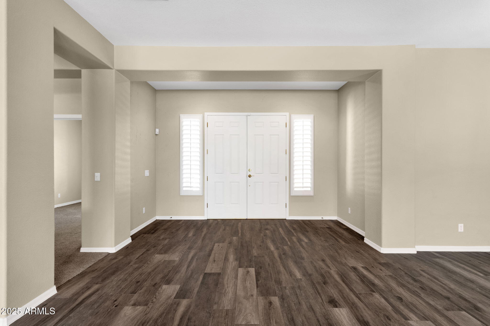4735 East Azalea Drive Gilbert, AZ 85298 - Photo 5 of 37 a view of a room with wooden floor and a window