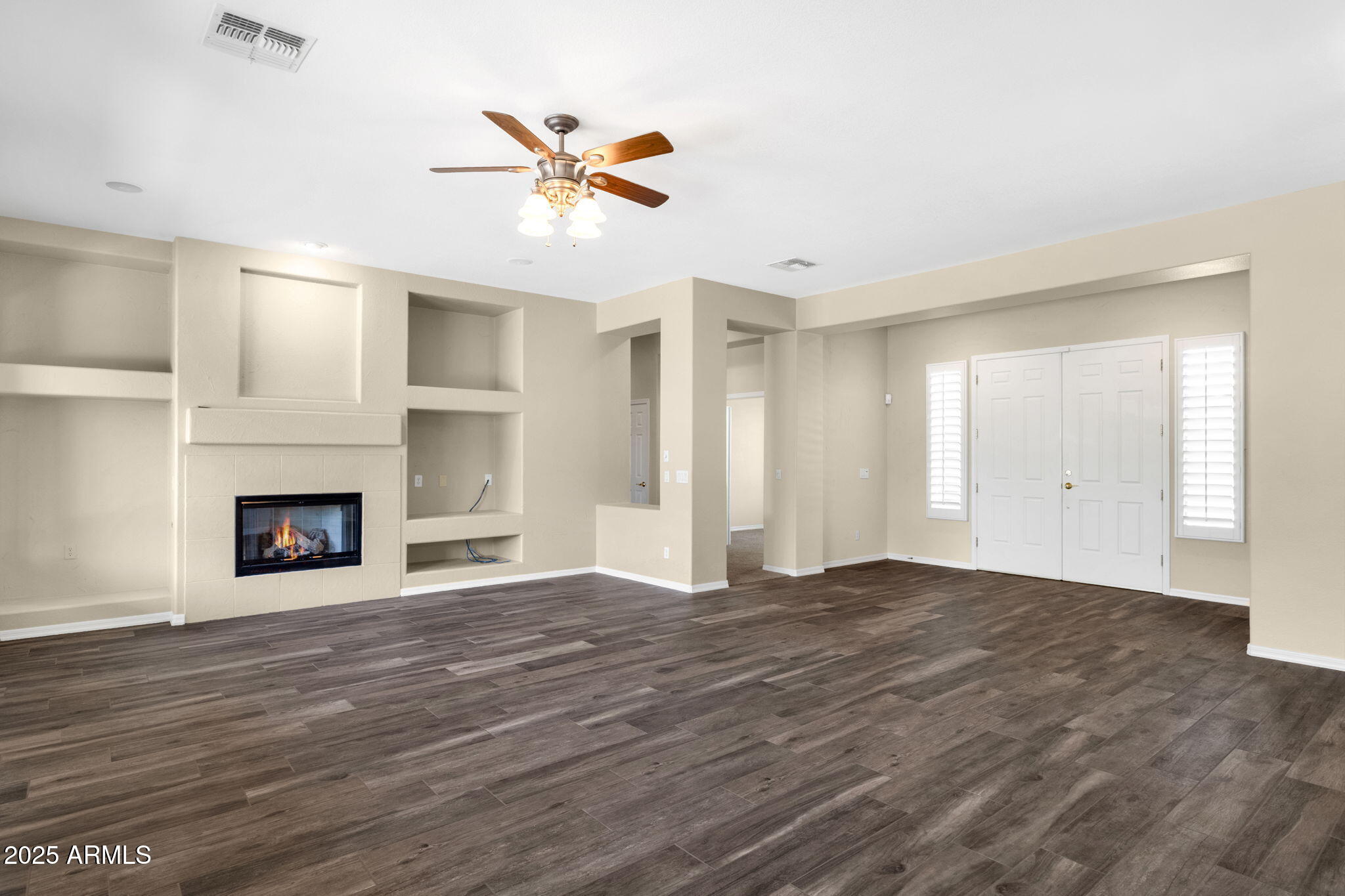 4735 East Azalea Drive Gilbert, AZ 85298 - Photo 8 of 37 a view of an empty room with window and fire place