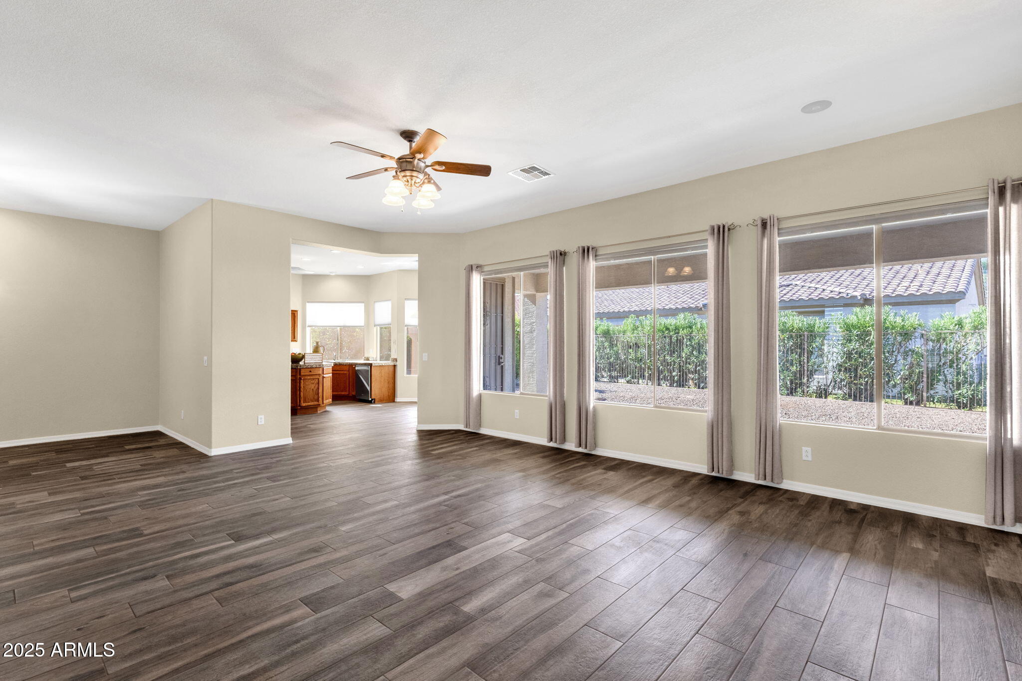 4735 East Azalea Drive Gilbert, AZ 85298 - Photo 9 of 37 a view of empty room with wooden floor and fan