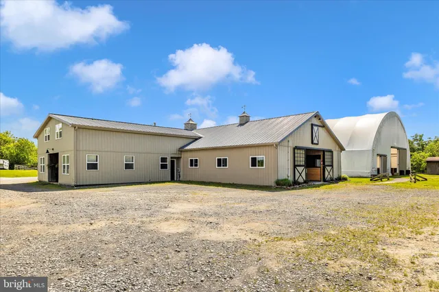 a front of a house with a yard and garage