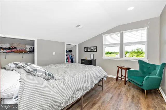 a bathroom with a sink vanity and a mirror
