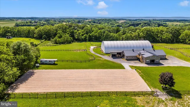 a view of a swimming pool with a garden and deck