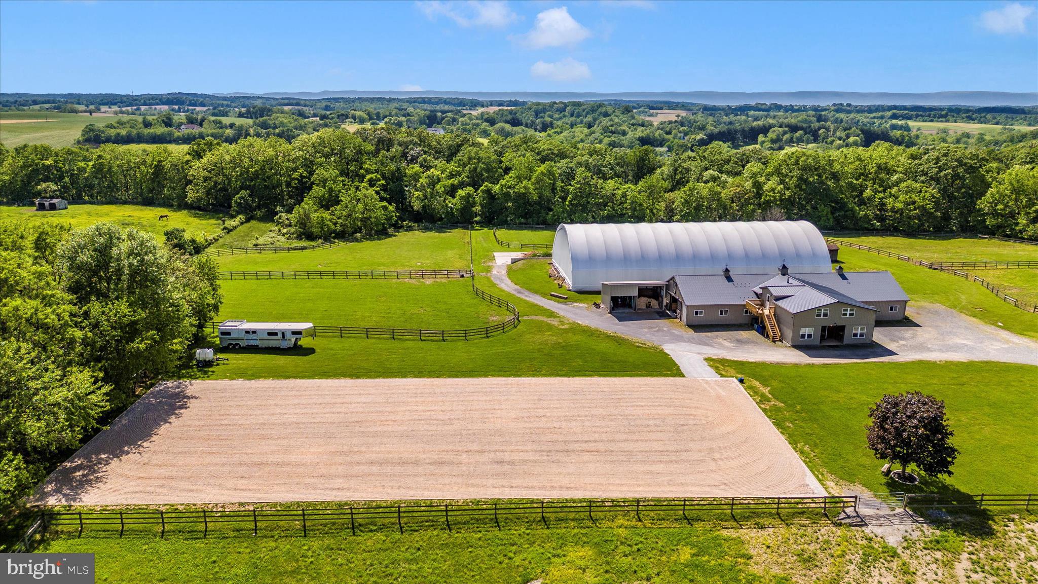10224 Bessie Clemson Road Union Bridge, MD 21791 - Photo 3 of 46 a view of a swimming pool with a garden and deck